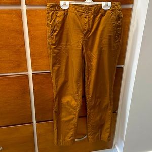 Copper brown straight leg pants. Button and zipper front. Pockets, front & back